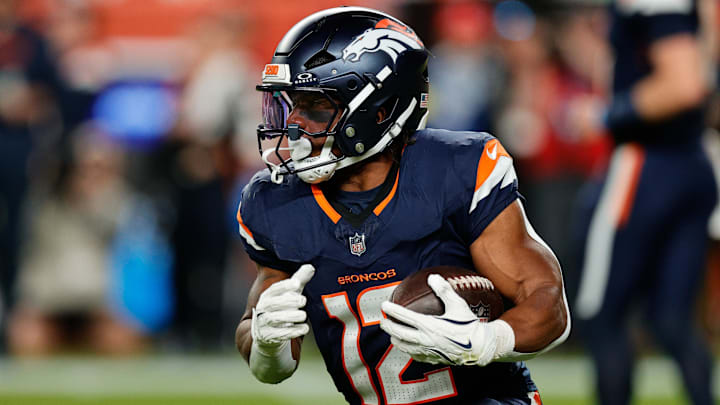 Sep 29, 2025; Denver, Colorado, USA; Denver Broncos running back RJ Harvey (12) rushes during the second quarter against the Cincinnati Bengals at Empower Field at Mile High.