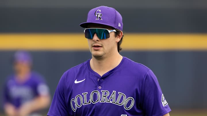 Mar 5, 2025; Peoria, Arizona, USA; Colorado Rockies infielder Michael Toglia against the San Diego Padres during a spring training game at Peoria Sports Complex. Mandatory Credit: Mark J. Rebilas-Imagn Images