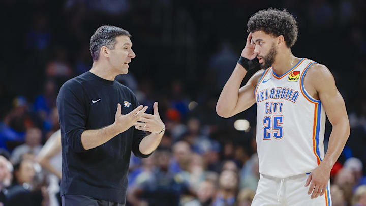 Oct 9, 2024; Oklahoma City, Oklahoma, USA; Oklahoma City Thunder head coach Mark Daigneault talks to guard Ajay Mitchell (25) during a break in play in the second half at Paycom Center. Mandatory Credit: Alonzo Adams-Imagn Images Oct 9, 2024; Oklahoma City, Oklahoma, USA; Oklahoma City Thunder head coach Mark Daigneault talks to guard Ajay Mitchell (25) during a break in play in the second half at Paycom Center. Mandatory Credit: Alonzo Adams-Imagn Images