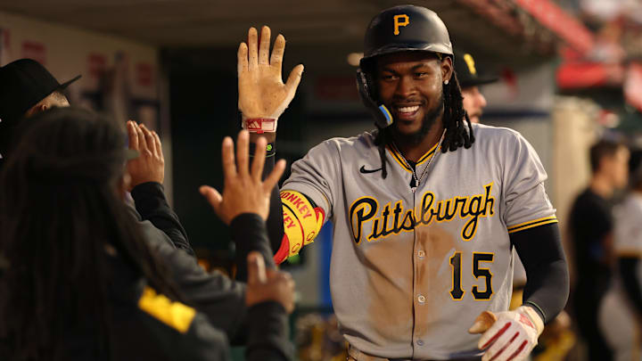 Apr 23, 2025; Anaheim, California, USA;  Pittsburgh Pirates center fielder Oneil Cruz (15) is greeted in the dugout after hitting a home run during the fifth inning against the Los Angeles Angels at Angel Stadium. Mandatory Credit: Kiyoshi Mio-Imagn Images