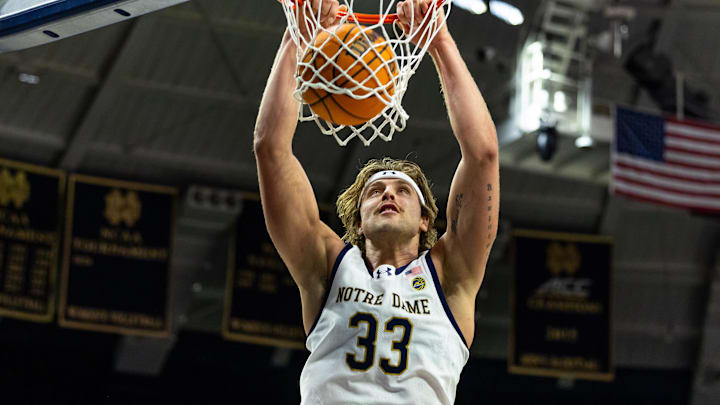 Feb 28, 2026; South Bend, Indiana, USA; Notre Dame Fighting Irish forward Carson Towt (33) dunks against the NC State Wolfpack during the first half at Purcell Pavilion at the Joyce Center. Mandatory Credit: Michael Caterina-Imagn Images