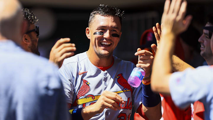 Aug 31, 2025; Cincinnati, Ohio, USA; St. Louis Cardinals outfielder Lars Nootbaar (21) high fives teammates after scoring on a sacrifice fly out hit by designated hitter Ivan Herrera (not pictured) in the third inning against the Cincinnati Reds at Great American Ball Park. Mandatory Credit: Katie Stratman-Imagn Images