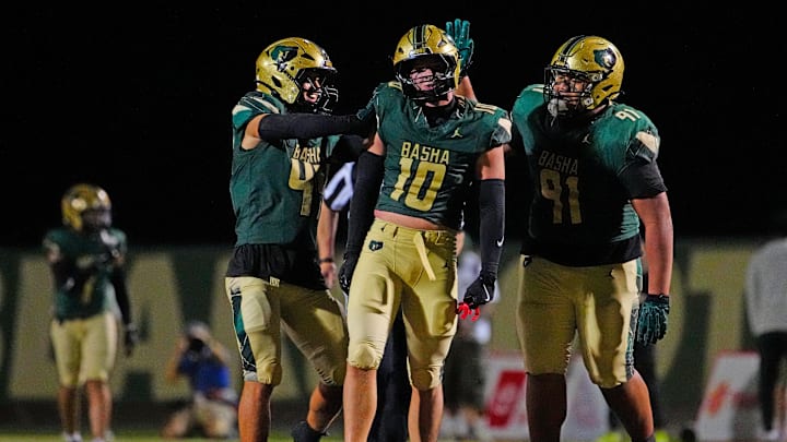 Basha edge rusher Dante Bruley (10) celebrates a sack with teammate Anitoni Tahi (91) and Eli Cramer-Cronin (44) during a game against Orange Lutheran (CA) at Basha High School in Chandler, on Sept. 5, 2025.