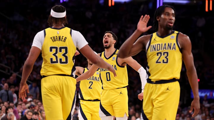 May 19, 2024; New York, New York, USA; Indiana Pacers guard Tyrese Haliburton (0) reacts with center Myles Turner (33) and guard Andrew Nembhard (2) and forward Aaron Nesmith (23) during the second quarter of game seven of the second round of the 2024 NBA playoffs at Madison Square Garden. Mandatory Credit: Brad Penner-Imagn Images