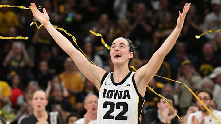 Mar 3, 2024; Iowa City, Iowa, USA; Iowa Hawkeyes guard Caitlin Clark (22) reacts during senior day after the game against the Ohio State Buckeyes. Clark broke the NCAA basketball all-time scoring record during the second quarter. Mandatory Credit: Jeffrey Becker-Imagn Images