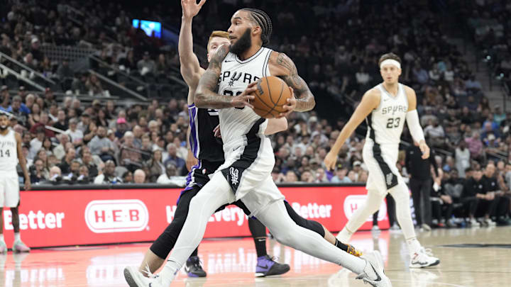 Nov 11, 2024; San Antonio, Texas, USA; San Antonio Spurs forward Julian Champagne (30) drives to the basket against the Sacramento Kings guard Kevin Huerter (9) during the first half at Frost Bank Center. Mandatory Credit: Scott Wachter-Imagn Images