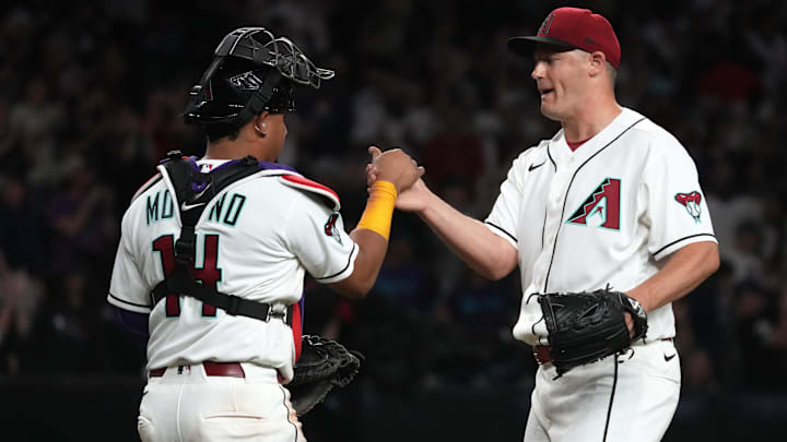Mar 30, 2026: Arizona Diamondbacks catcher Gabriel Moreno (14) and pitcher Paul Sewald (38) celebrates after defeating the Detroit Tigers at Chase Field. Mar 30, 2026: Arizona Diamondbacks catcher Gabriel Moreno (14) and pitcher Paul Sewald (38) celebrates after defeating the Detroit Tigers at Chase Field.