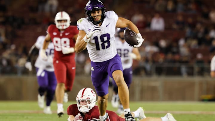 Aug 30, 2024; Stanford, California, USA; TCU Horned Frogs wide receiver Jack Bech (18) runs with the ball past Stanford Cardinal safety Scotty Edwards (21) during the second half at Stanford Stadium. Mandatory Credit: Sergio Estrada-Imagn Images