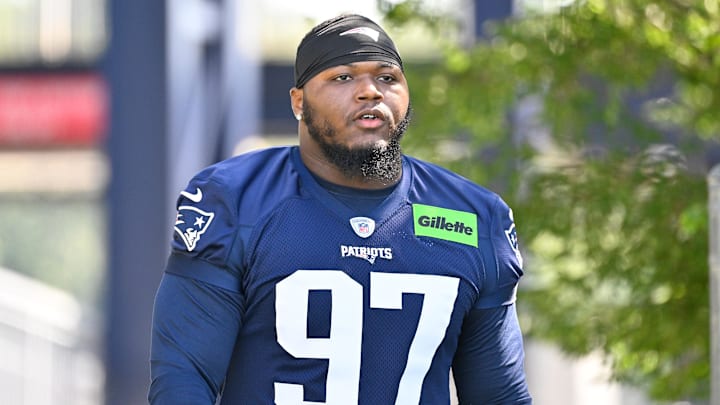 Jul 23, 2025; Foxborough, MA, USA; New England Patriots defensive end Milton Williams (97) walks to the practice field for training camp at Gillette Stadium. Mandatory Credit: Eric Canha-Imagn Images