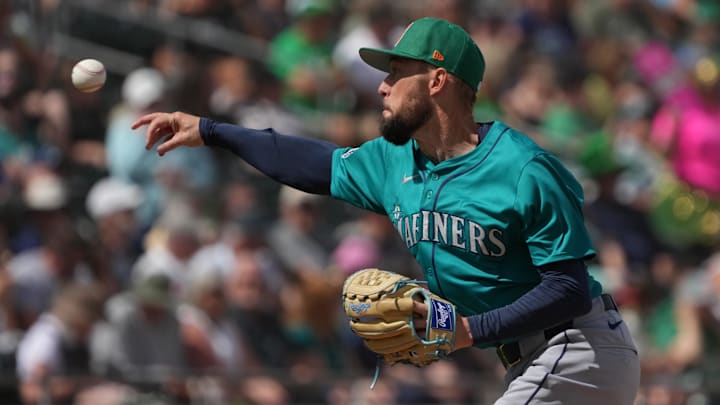Mar 17, 2025; Mesa, Arizona, USA; Seattle Mariners pitcher Casey Lawrence throws against the Oakland Athletics in the third inning at Hohokam Stadium. Mandatory Credit: Rick Scuteri-Imagn Images