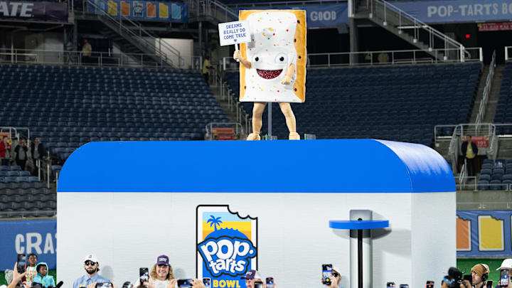 Dec 28, 2023; Orlando, FL, USA; Pop Tart mascot signals the end of the celebration after the game at Camping World Stadium. Mandatory Credit: Jeremy Reper-Imagn Images
