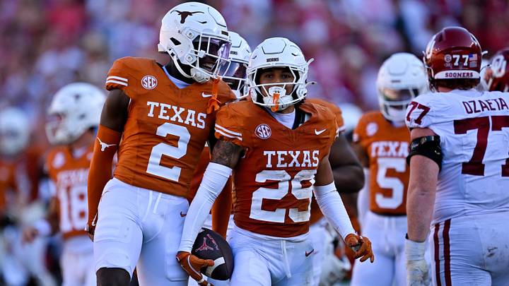 Texas Longhorns defensive back Derek Williams Jr. and defensive back Graceson Littleton celebrate after Littleton intercepts a pass from Oklahoma Sooners quarterback John Mateer (not pictured) Texas Longhorns defensive back Derek Williams Jr. and defensive back Graceson Littleton celebrate after Littleton intercepts a pass from Oklahoma Sooners quarterback John Mateer (not pictured)