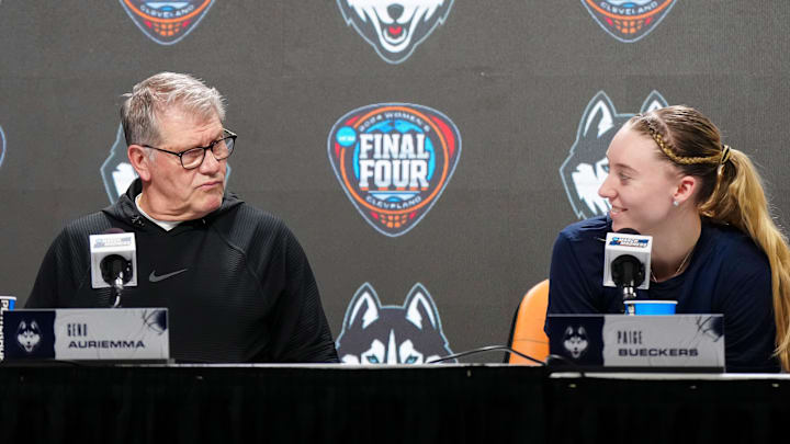 Apr 4, 2024; Cleveland, OH, USA; UConn Huskies coach Geno Auriemma (left) and guard Paige Bueckers during press conference at Rocket Mortgage FieldHouse. Mandatory Credit: Kirby Lee-Imagn Images