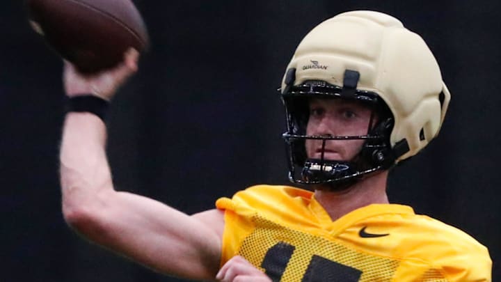 Purdue Boilermakers quarterback Ryan Browne (15) throws the ball