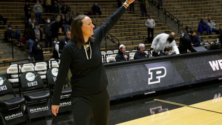 Purdue head coach Katie Gearlds waves at the fans.