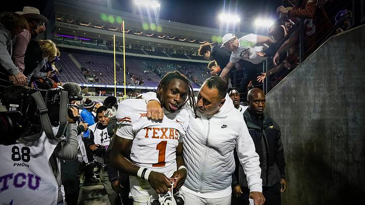 Texas Longhorns head coach Steve Sarkisian hugs Texas Longhorns wide receiver Xavier Worthy (1).