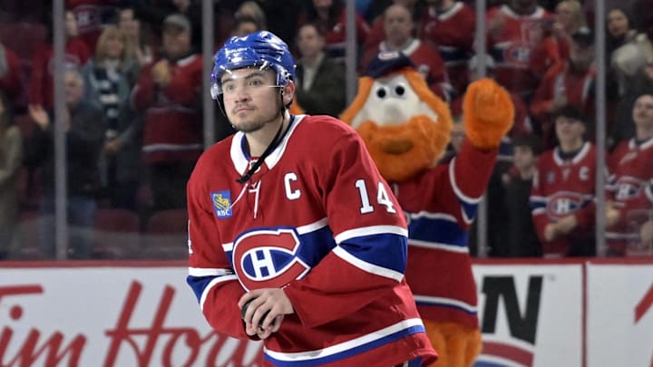 Apr 5, 2025; Montreal, Quebec, CAN; Montreal Canadiens forward Nick Suzuki (14) celebrates the win against the Philadelphia Flyers at the Bell Centre. Mandatory Credit: Eric Bolte-Imagn Images