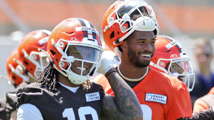 Cleveland Browns running back Quinshon Judkins (10) and quarterback Shedeur Sanders (12) share a laugh on the sideline during NFL rookie minicamp at the Cleveland Browns training facility on Friday, May 9, 2025, in Berea, Ohio. Cleveland Browns running back Quinshon Judkins (10) and quarterback Shedeur Sanders (12) share a laugh on the sideline during NFL rookie minicamp at the Cleveland Browns training facility on Friday, May 9, 2025, in Berea, Ohio.