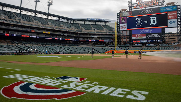 Heather Nabozny, the head groundkeeper for the Detroit Tigers, waters the field.