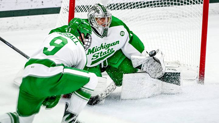Michigan State's Trey Augustine, right, deflects a Notre Dame shot during the first period on Thursday, Feb. 19, 2026, at the Munn Ice Arena in East Lansing. Michigan State's Trey Augustine, right, deflects a Notre Dame shot during the first period on Thursday, Feb. 19, 2026, at the Munn Ice Arena in East Lansing.