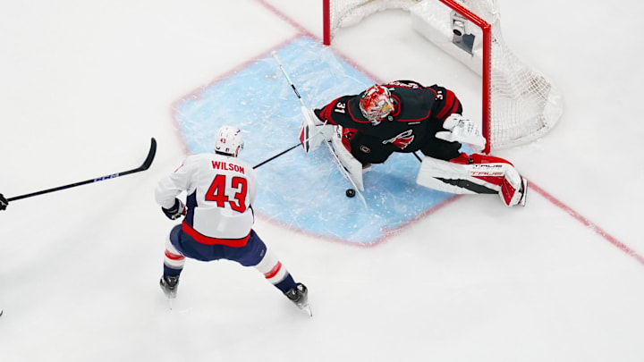 May 10, 2025; Raleigh, North Carolina, USA; Carolina Hurricanes goaltender Frederik Andersen (31) stops the break away scoring attempt by Washington Capitals right wing Tom Wilson (43) during the first period in game three of the second round of the 2025 Stanley Cup Playoffs at Lenovo Center. Mandatory Credit: James Guillory-Imagn Images