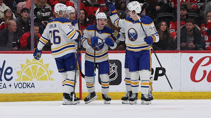 Zach Benson surrounded by his Buffalo Sabres teammates Zach Benson surrounded by his Buffalo Sabres teammates
