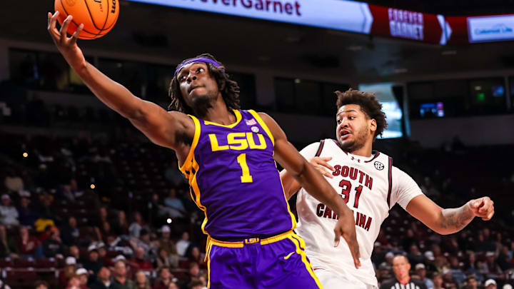 Jan 31, 2026; Columbia, South Carolina, USA; Louisiana State Tigers center Michael Nwoko (1) drives past South Carolina Gamecocks forward Elijah Strong (31) in the second half at Colonial Life Arena. Mandatory Credit: Jeff Blake-Imagn Images