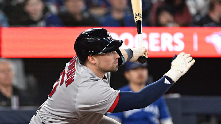 Apr 27, 2026; Toronto, Ontario, CAN;  Boston Red Sox thrid baseman Caleb Durbin (5) hits an RBI single against the Toronto Blue Jays in the sixth inning at Rogers Centre. Mandatory Credit: Dan Hamilton-Imagn Images