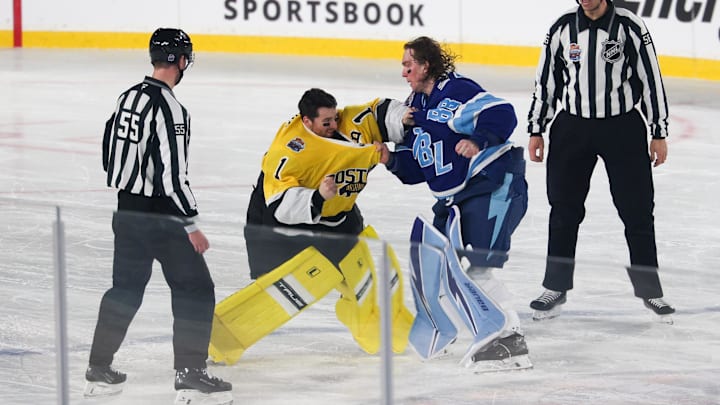 Feb 1, 2026; Tampa Bay, Florida, USA; Boston Bruins goaltender Jeremy Swayman (1) and Tampa Bay Lightning goaltender Andrei Vasilevskiy (88) exchange punches as officials Kyle Flemington and Julien Fournier look on during the second period in the 2026 Stadium Series ice hockey game at Raymond James Stadium. Mandatory Credit: Nathan Ray Seebeck-Imagn Images Feb 1, 2026; Tampa Bay, Florida, USA; Boston Bruins goaltender Jeremy Swayman (1) and Tampa Bay Lightning goaltender Andrei Vasilevskiy (88) exchange punches as officials Kyle Flemington and Julien Fournier look on during the second period in the 2026 Stadium Series ice hockey game at Raymond James Stadium. Mandatory Credit: Nathan Ray Seebeck-Imagn Images
