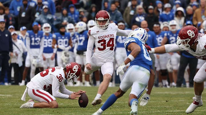 Nov 18, 2023; Provo, Utah, USA; Oklahoma Sooners place kicker Zach Schmit (34) kicks a field goal against the Brigham Young Cougars in the second quarter at LaVell Edwards Stadium. Mandatory Credit: Rob Gray-Imagn Images