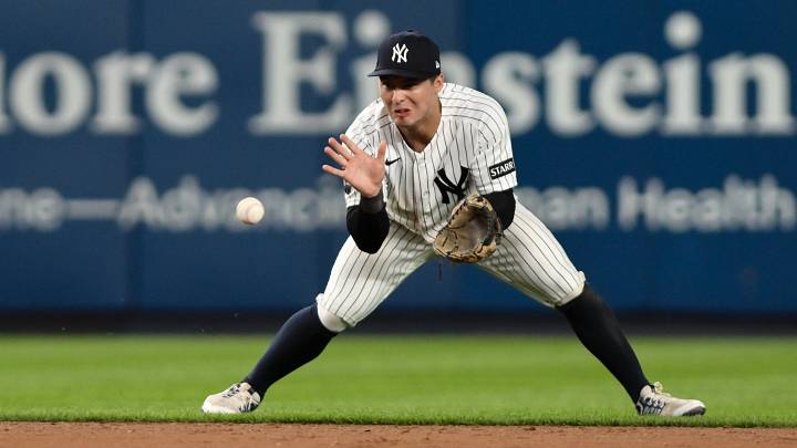 Jun 16, 2026; Bronx, New York, USA; New York Yankees shortstop Anthony Volpe (11) fields a ground ball hit by Chicago White Sox center fielder Luisangel Acuña (not pictured) and throws to first base for an out during the ninth inning at Yankee Stadium. Mandatory Credit: John Jones-Imagn Images
