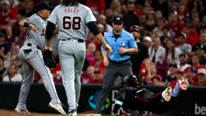 Cincinnati Reds shortstop Elly De La Cruz (44) dives into first as Detroit Tigers third baseman Gio Urshela (13) misses the out by stepping off the bag in the ninth inning of the MLB game between the Cincinnati Reds and the Detroit Tigers at Great American Ball Park in Cincinnati on Friday, July 5, 2024. Cincinnati Reds shortstop Elly De La Cruz (44) dives into first as Detroit Tigers third baseman Gio Urshela (13) misses the out by stepping off the bag in the ninth inning of the MLB game between the Cincinnati Reds and the Detroit Tigers at Great American Ball Park in Cincinnati on Friday, July 5, 2024.