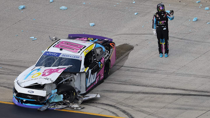 Sheldon Creed stands by his wrecked No. 00 Haas Factory Team Ford after a scary crash in Saturday's NASCAR Xfinity Series race at Bristol.