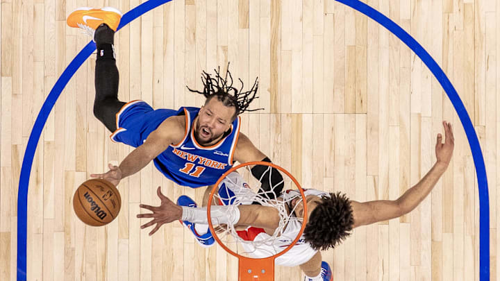 Apr 27, 2025; Detroit, Michigan, USA; New York Knicks guard Jalen Brunson (11) drives to the basket as Detroit Pistons guard Cade Cunningham (2) defends during the second half of game four of first round for the 2025 NBA Playoffs at Little Caesars Arena. Mandatory Credit: David Reginek-Imagn Images