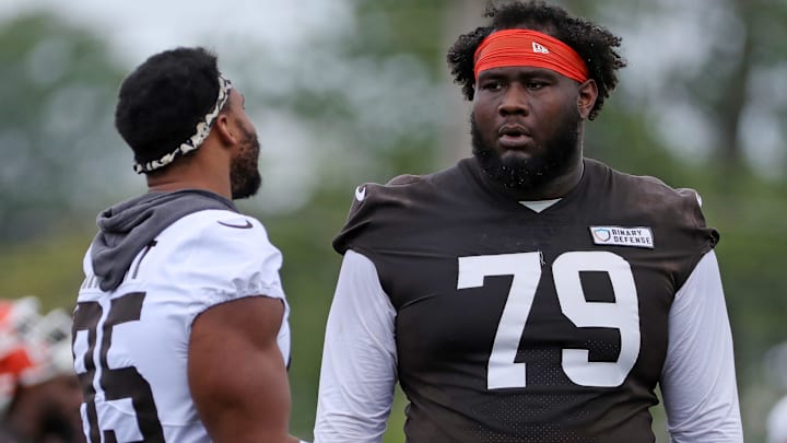 Cleveland Browns offensive tackle Dawand Jones (79) chats with defensive end Myles Garrett (95) during practice at NFL minicamp, Tuesday, June 10, 2025, in Berea, Ohio. [Jeff Lange/Beacon Journal]