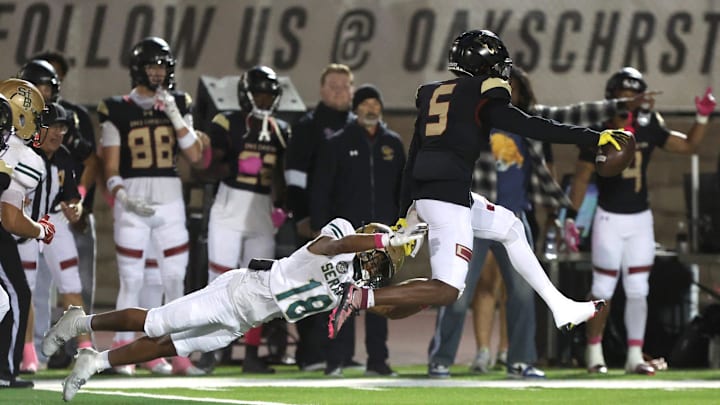 Oaks Christian's Davon Benjamin heads for the end zone on an interception return.