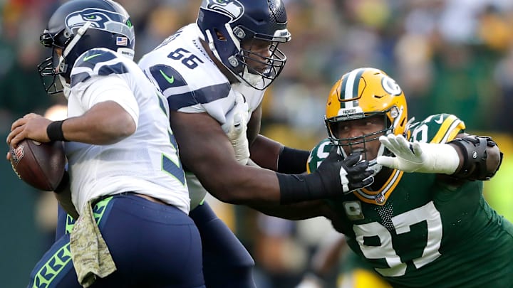Packers defensive tackle Kenny Clark pressures former Seahawks quarterback Russell Wilson in 2021.