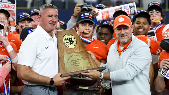 Head coach Bill Elliott of Celina (left) proudly holds the trophy following his team's victory over Kilgore in the Texas 4A Division 1 title game at AT&T Stadium. Celina enters the 2025 season ranked in our Top 25. 