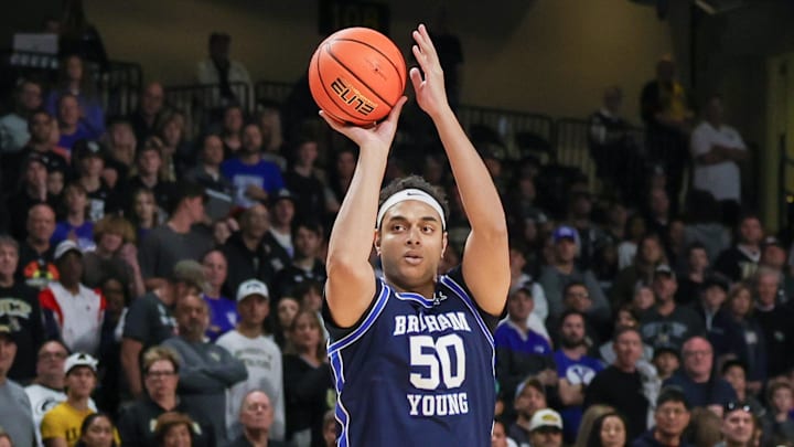 Jan 13, 2024; Orlando, Florida, USA; Brigham Young Cougars center Aly Khalifa (50) shoots a three