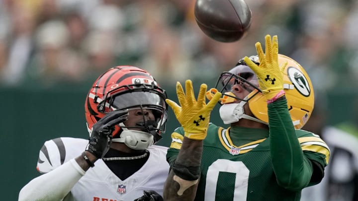 Green Bay Packers wide receiver Matthew Golden (0) makes a 35-yard reception while being covered by Cincinnati Bengals cornerback Cam Taylor-Britt (29) during the second quarter of their game Sunday, October 12, 2025 at Lambeau Field in Green Bay, Wisconsin.