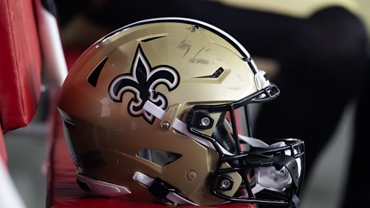Aug 10, 2024; Glendale, Arizona, USA; Detailed view of a New Orleans Saints helmet during a preseason NFL game at State Farm Stadium. Mandatory Credit: Mark J. Rebilas-Imagn Images