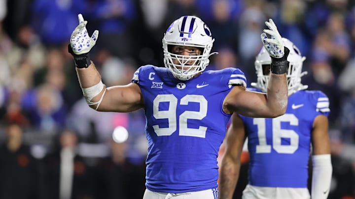 Oct 18, 2024; Provo, Utah, USA; Brigham Young Cougars defensive end Tyler Batty (92) encourages fans to cheer against the Oklahoma State Cowboys during the fourth quarter at LaVell Edwards Stadium.