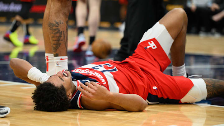 Jan 1, 2025; Washington, District of Columbia, USA; Washington Wizards guard Jordan Poole (13) reacts after falling during the second quarter against the Chicago Bulls at Capital One Arena. Jan 1, 2025; Washington, District of Columbia, USA; Washington Wizards guard Jordan Poole (13) reacts after falling during the second quarter against the Chicago Bulls at Capital One Arena.
