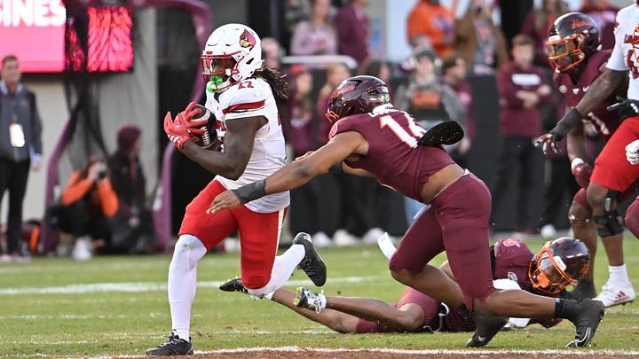 Nov 1, 2025; Blacksburg, Virginia, USA; Virginia Tech Hokies linebacker Noah Chambers (16) tackles Louisville Cardinals running back Keyjuan Brown (22) during the fourth quarter at Lane Stadium. Mandatory Credit: Brian Bishop-Imagn Images Nov 1, 2025; Blacksburg, Virginia, USA; Virginia Tech Hokies linebacker Noah Chambers (16) tackles Louisville Cardinals running back Keyjuan Brown (22) during the fourth quarter at Lane Stadium. Mandatory Credit: Brian Bishop-Imagn Images