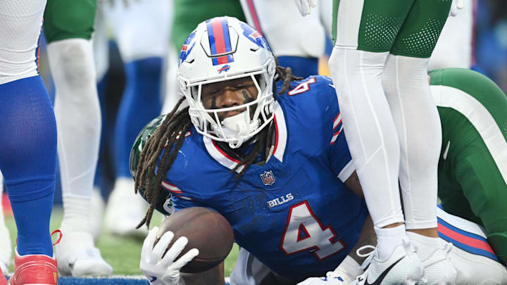 Dec 29, 2024; Orchard Park, New York, USA; Buffalo Bills running back James Cook (4) lands in the endzone