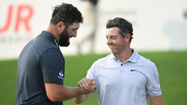 Rory McIlroy (right, with Jon Rahm at the 2023 Tour Championship), said Rahm and fellow LIV Golf player Tyrrell Hatton should pay their accumulated fines to the DP World Tour. Rory McIlroy (right, with Jon Rahm at the 2023 Tour Championship), said Rahm and fellow LIV Golf player Tyrrell Hatton should pay their accumulated fines to the DP World Tour.