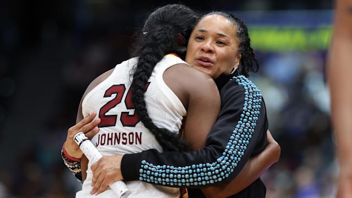Apr 6, 2025; Tampa, FL, USA; South Carolina Gamecocks head coach Dawn Staley hugs guard Raven Johnson (25) during the second half of the national championship of the women's 2025 NCAA tournament at Amalie Arena. Mandatory Credit: Nathan Ray Seebeck-Imagn Images