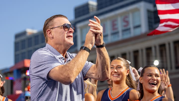 Illinois basketball coach Brad Underwood excites the crowd at Memorial Stadium in Champaign, Illinois, during the Illini football team's 34-32 win over USC on Sept. 27, 2025. Illinois basketball coach Brad Underwood excites the crowd at Memorial Stadium in Champaign, Illinois, during the Illini football team's 34-32 win over USC on Sept. 27, 2025.