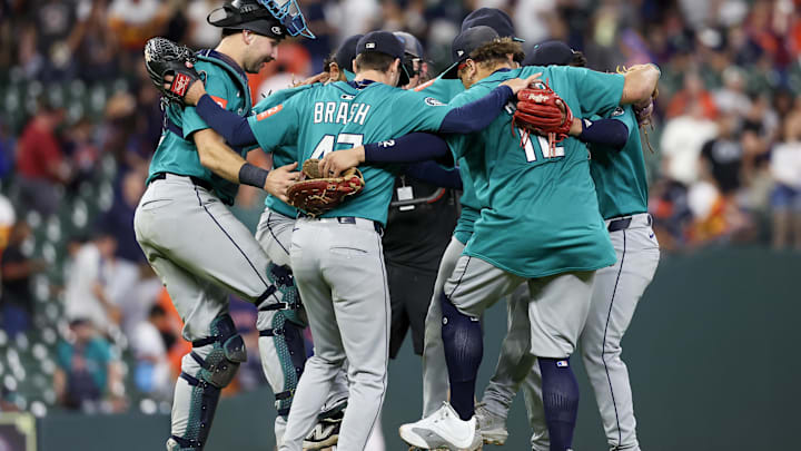 Sep 21, 2025; Houston, Texas, USA; Seattle Mariners relief pitcher Matt Brash (47) and teammates celebrate after defeating the Houston Astros at Daikin Park. Mandatory Credit: Thomas Shea-Imagn Images
