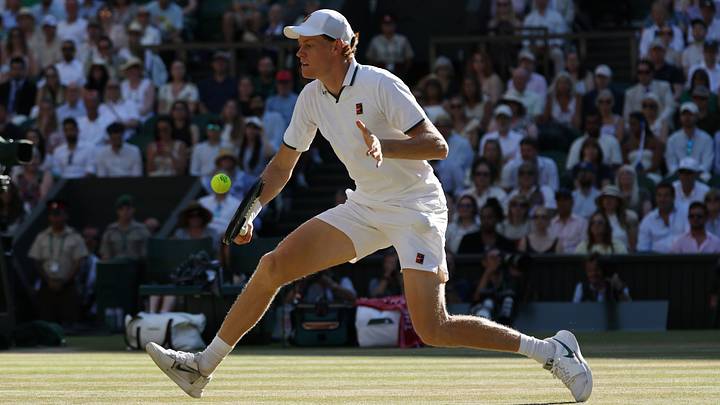 Jannik Sinner hits a volley in the gentlemen's singles final of The Championships Wimbledon 2026 at All England Lawn Tennis and Croquet Club. Mandatory Credit: Geoff Burke-Imagn Images